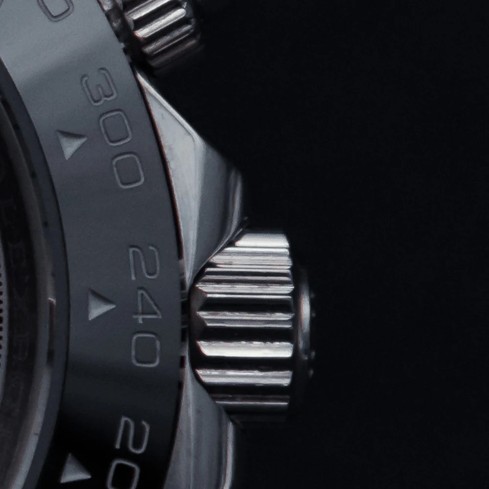Rolex Cosmograph Daytona — Detail: Triplock-Krone und Drücker